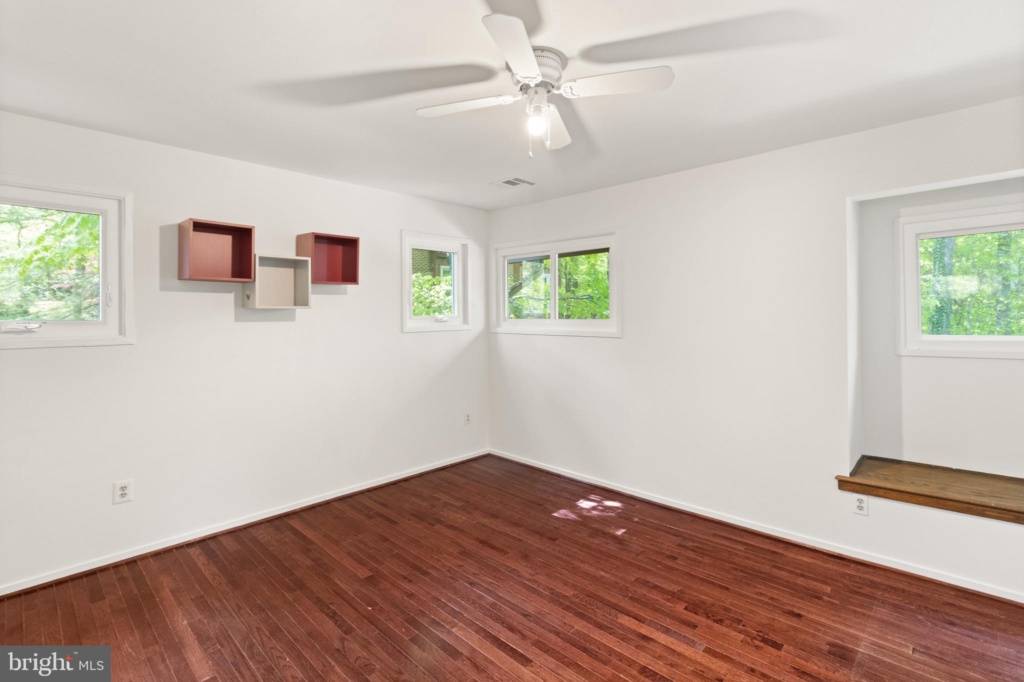 9220 Beech Hill Drive Bethesda, MD 20817 - Photo 28 of 50 a view of a room with wooden floor and window