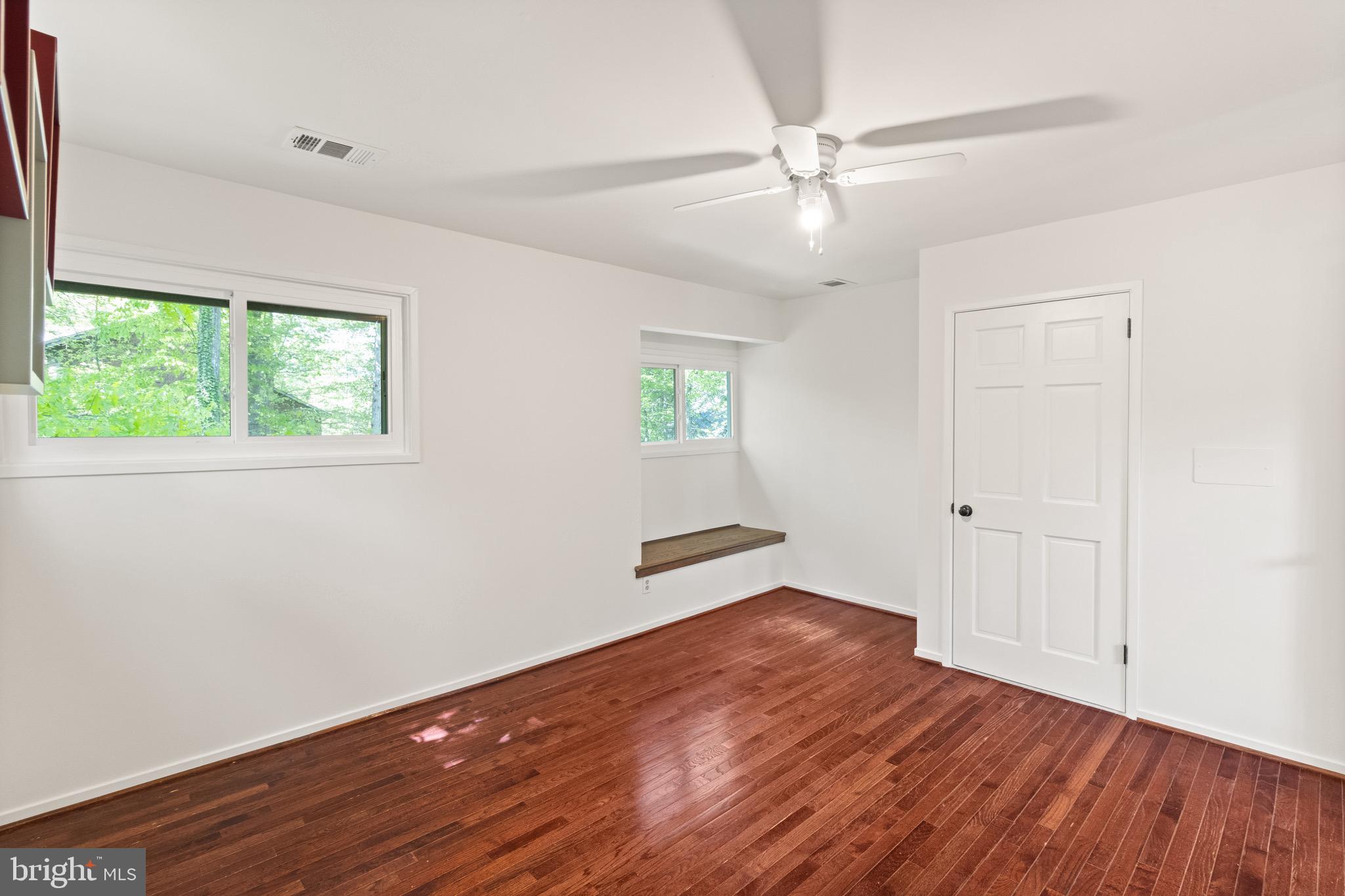 9220 Beech Hill Drive Bethesda, MD 20817 - Photo 29 of 50 wooden floor in an empty room with a window