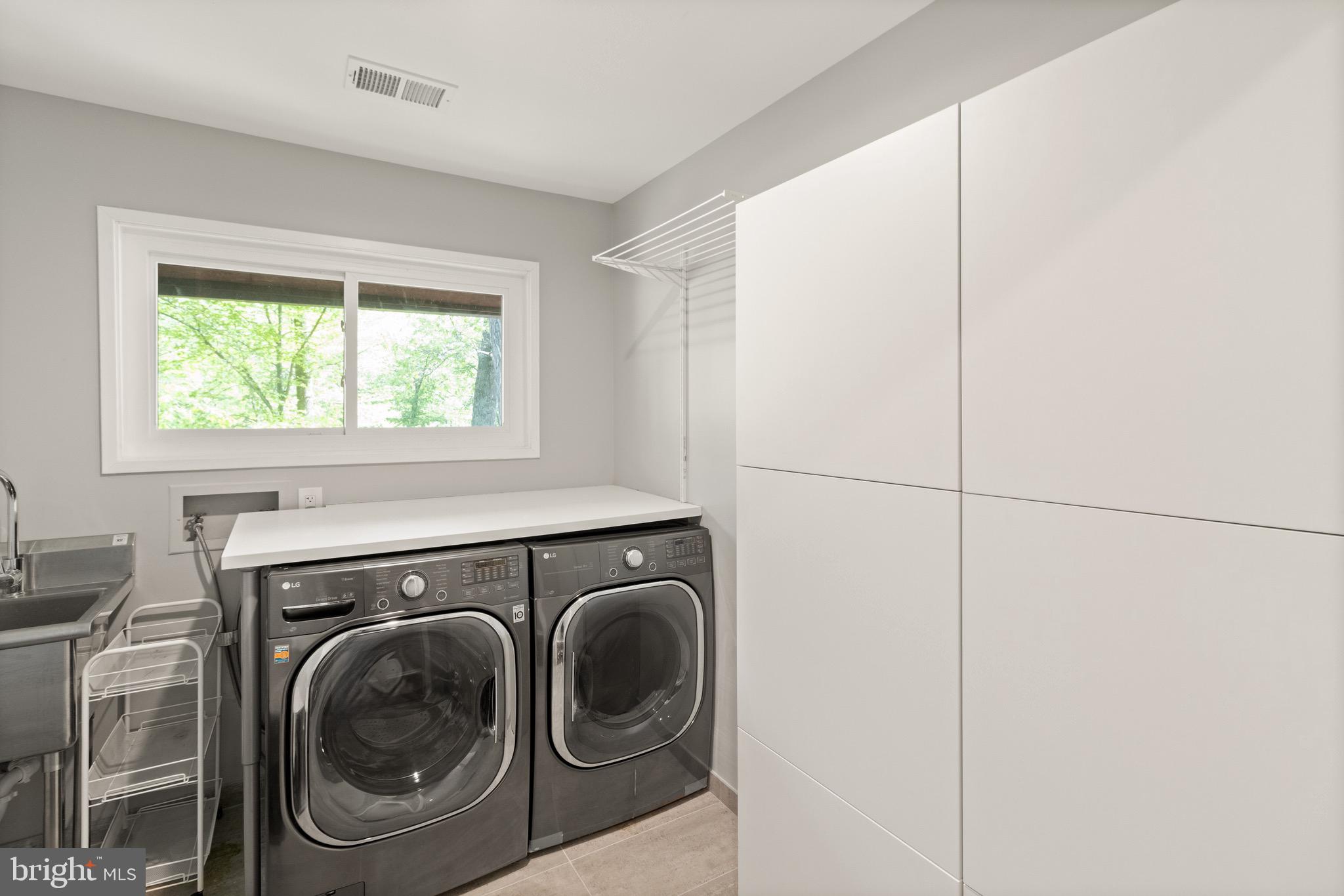 9220 Beech Hill Drive Bethesda, MD 20817 - Photo 35 of 50 a utility room with dryer and washer