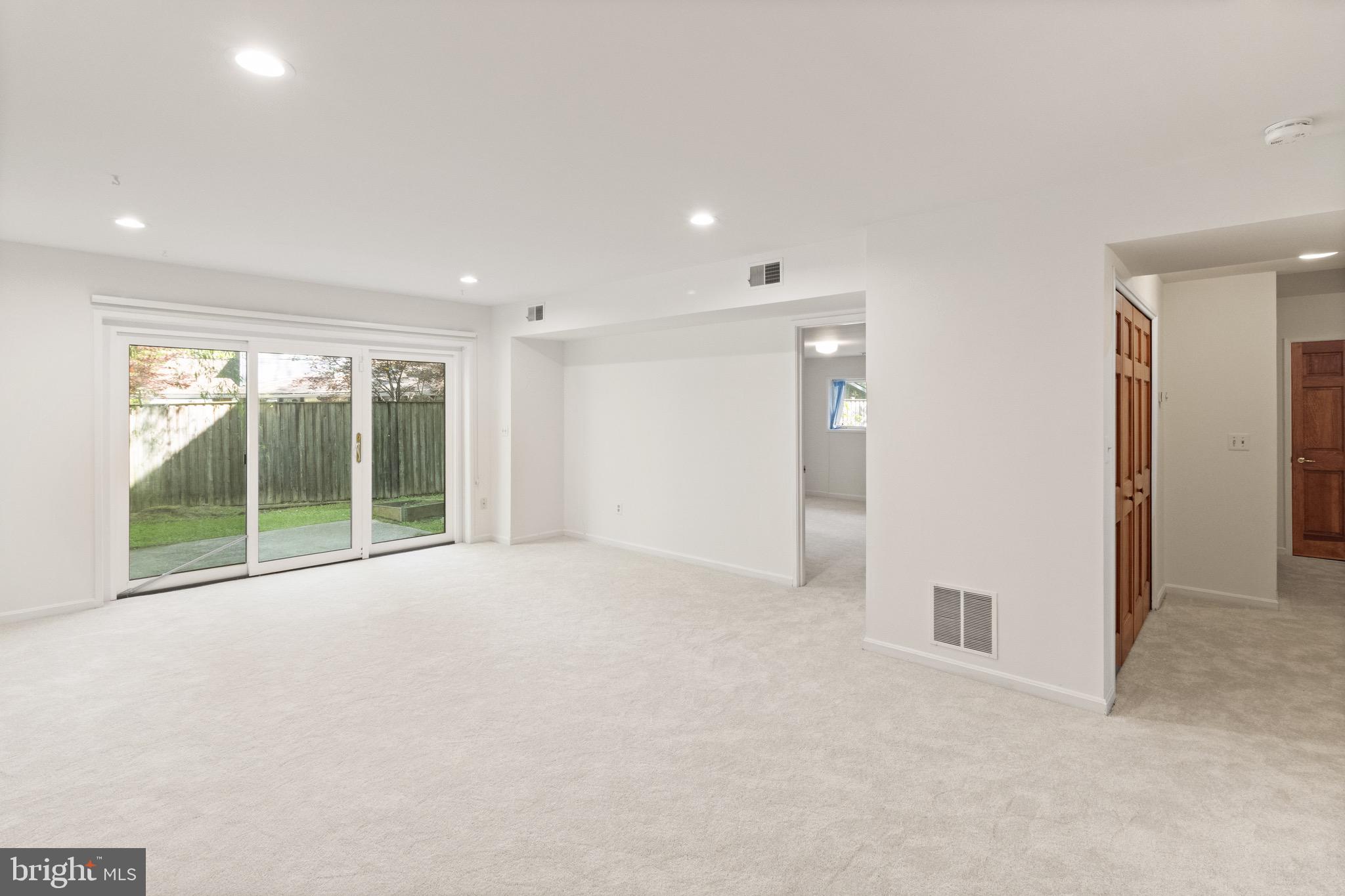9220 Beech Hill Drive Bethesda, MD 20817 - Photo 37 of 50 a view of an empty room with glass door and balcony