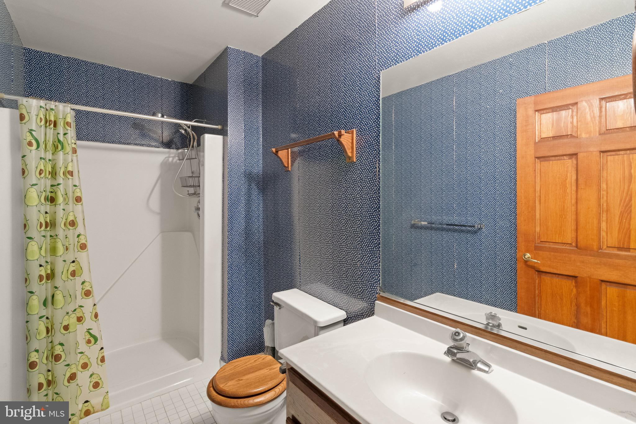 9220 Beech Hill Drive Bethesda, MD 20817 - Photo 45 of 50 a bathroom with a sink toilet and shower