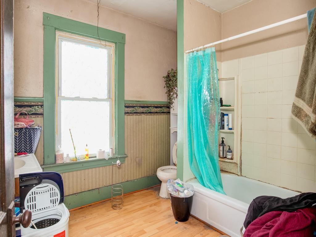 406 Connecticut Avenue Rochester, PA 15074 - Photo 20 of 25 a living room with furniture and a window