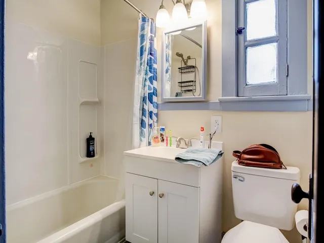 a bathroom with a sink a toilet and a bathtub