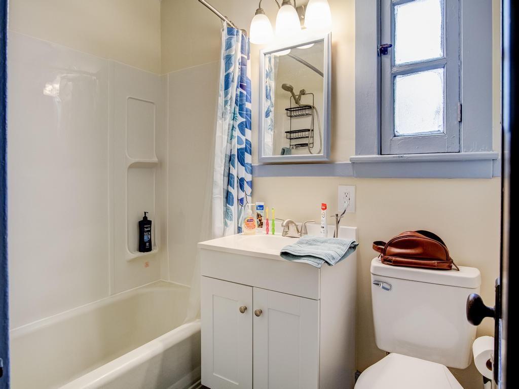 406 Connecticut Avenue Rochester, PA 15074 - Photo 6 of 25 a bathroom with a sink a toilet and a bathtub