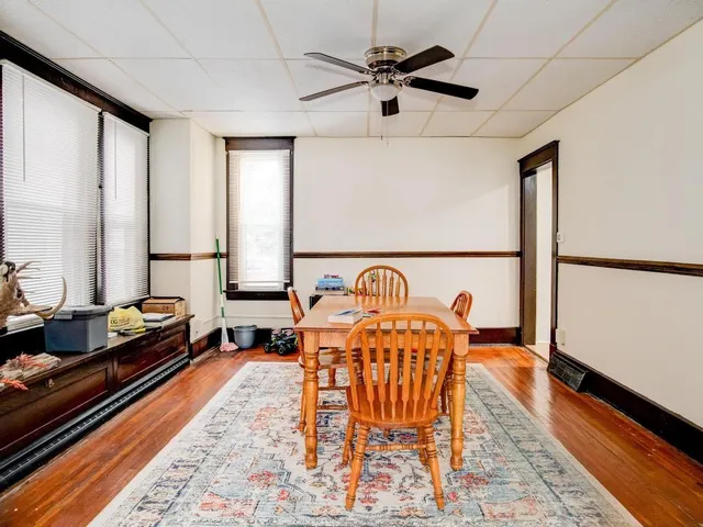 a living room with furniture and a rug