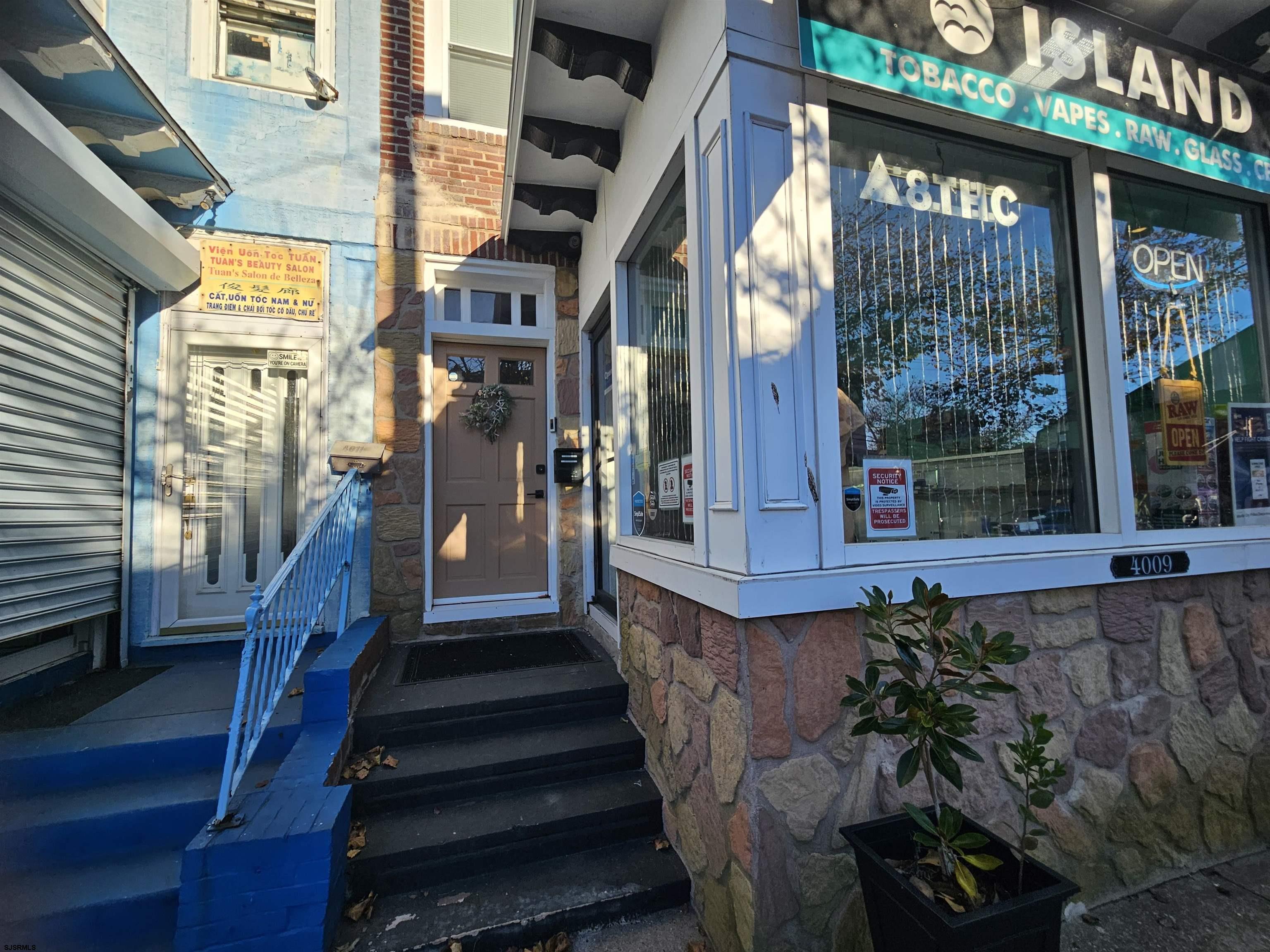 4009 Ventnor, Unit 2 Atlantic City, NJ 08401 - Photo 1 of 32 a view of a building with a potted plant