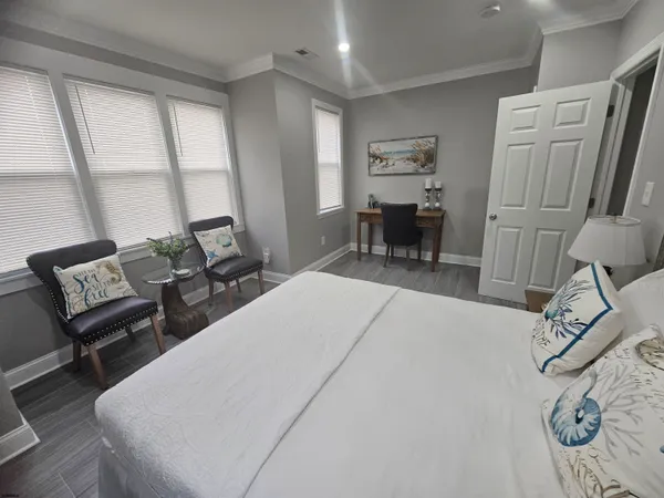 a bed room with a bed and a chair