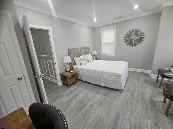 a bedroom with a bed and a dresser