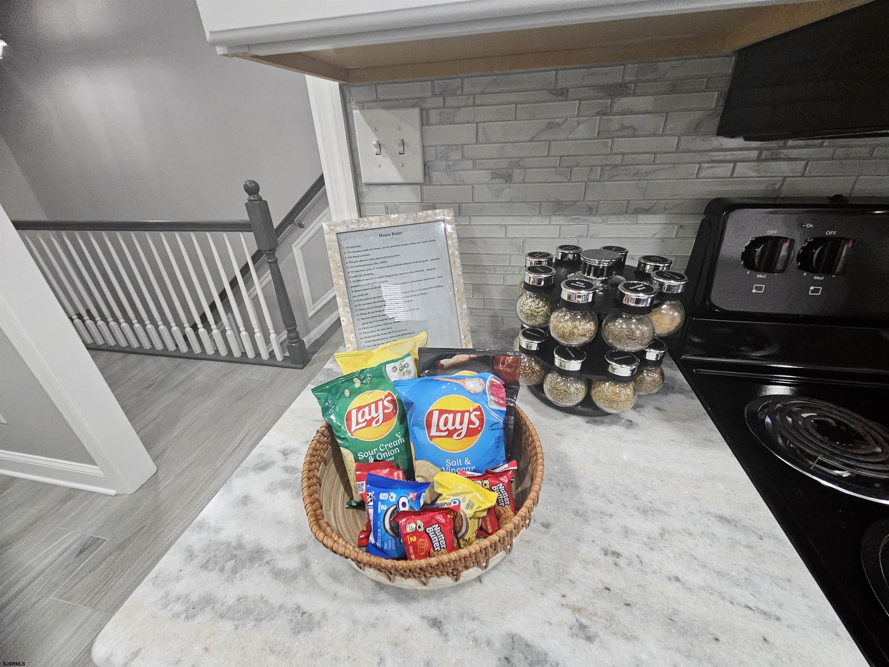 4009 Ventnor, Unit 2 Atlantic City, NJ 08401 - Photo 14 of 32 a bedroom with furniture and a wooden floor