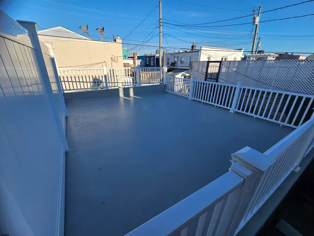 a view of a balcony with car parked