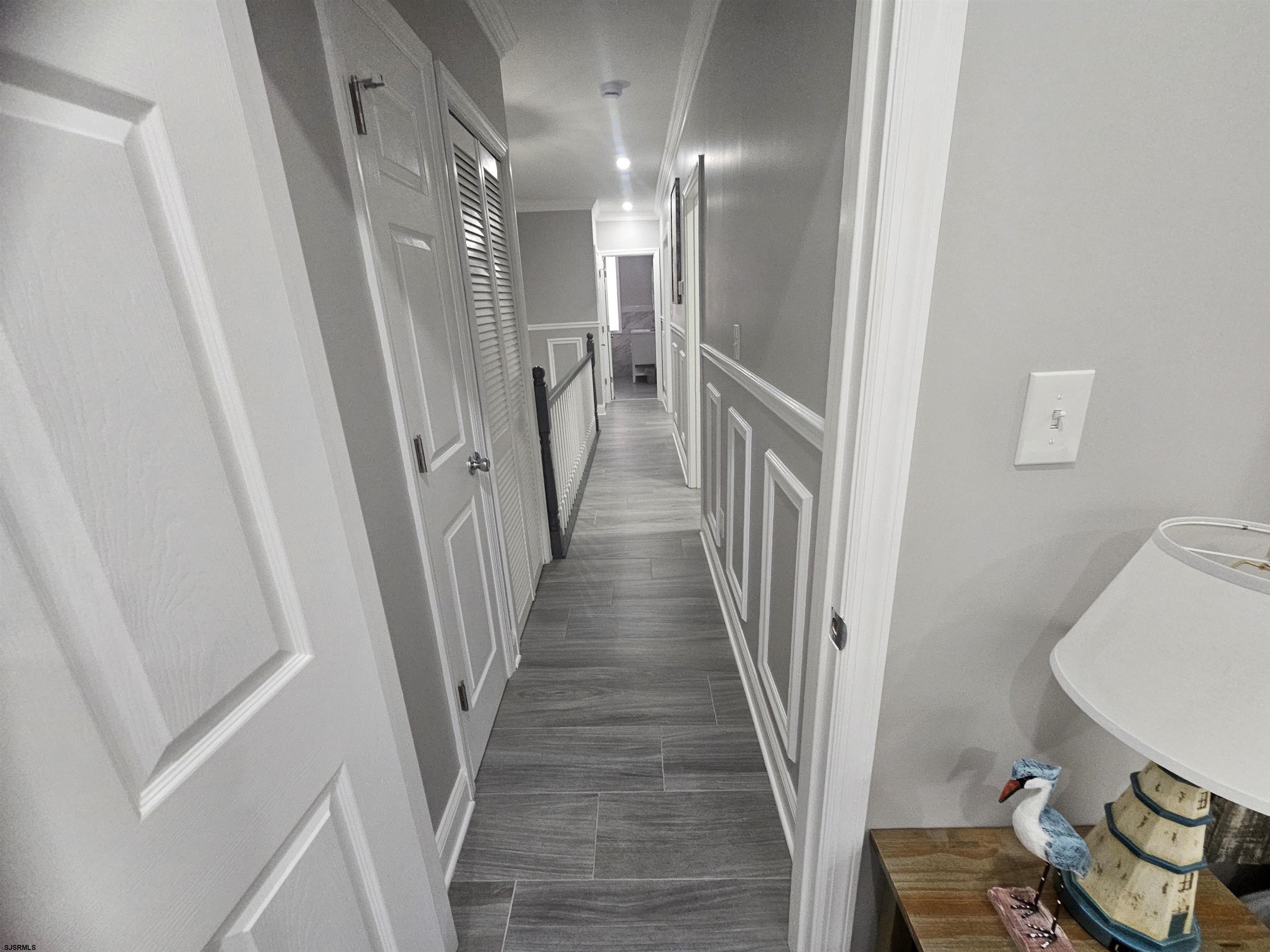 4009 Ventnor, Unit 2 Atlantic City, NJ 08401 - Photo 26 of 32 a view of a hallway with furniture and stairs