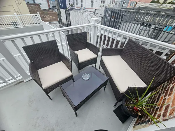a view of a balcony with chairs