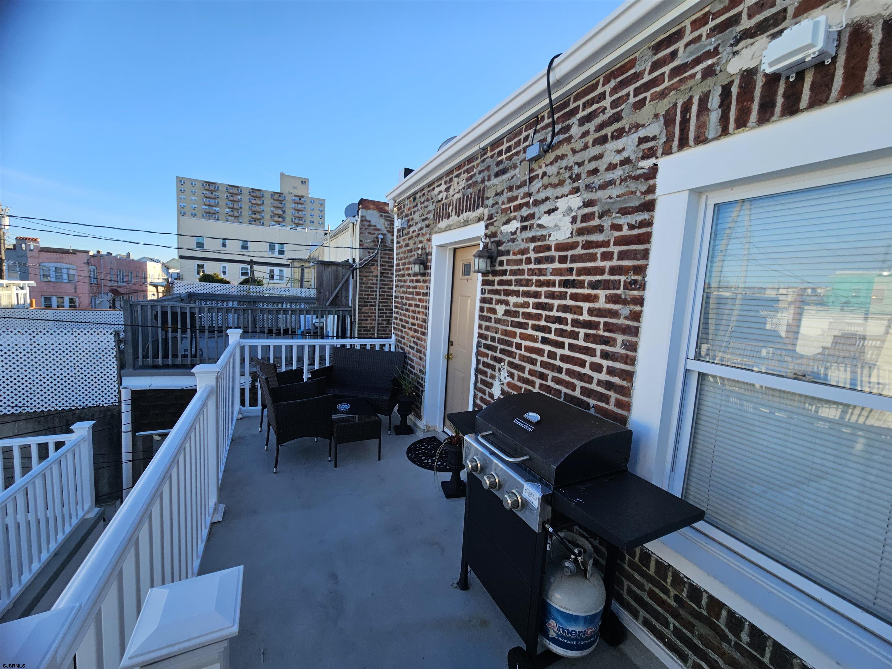 4009 Ventnor, Unit 2 Atlantic City, NJ 08401 - Photo 4 of 32 a view of a balcony with chairs