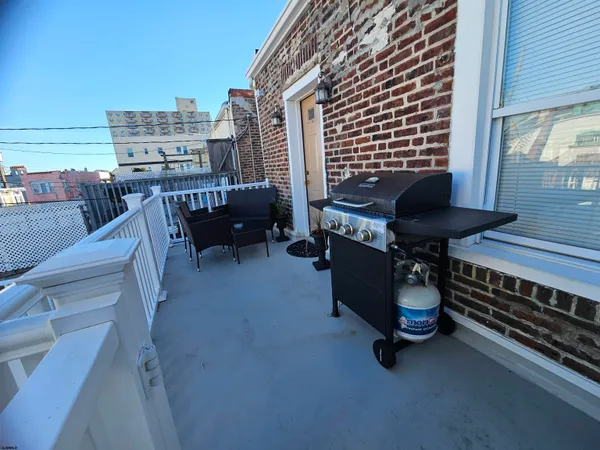 a view of a terrace with chairs