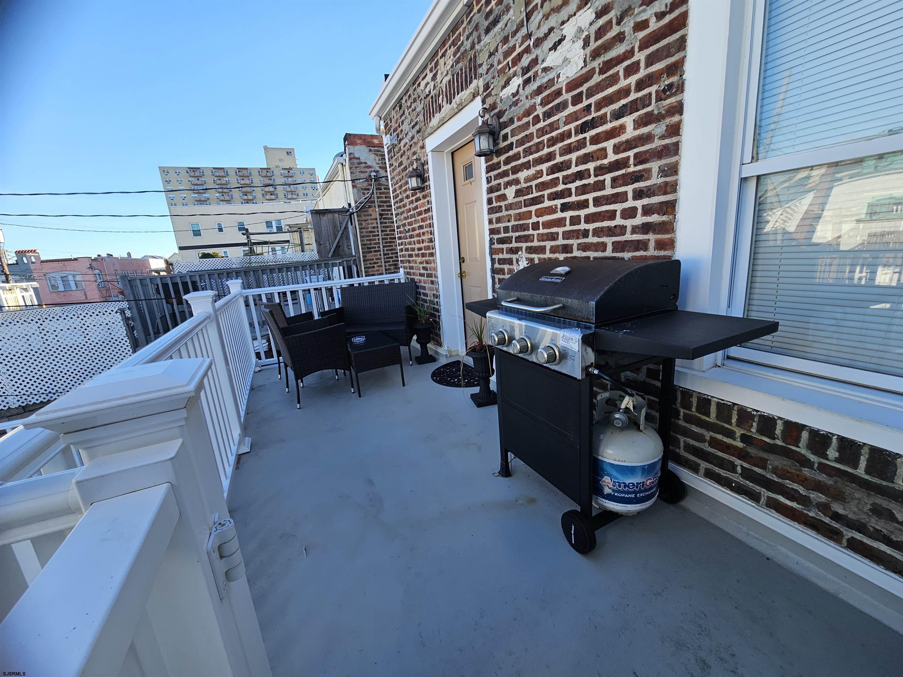 4009 Ventnor, Unit 2 Atlantic City, NJ 08401 - Photo 5 of 32 a view of a terrace with chairs
