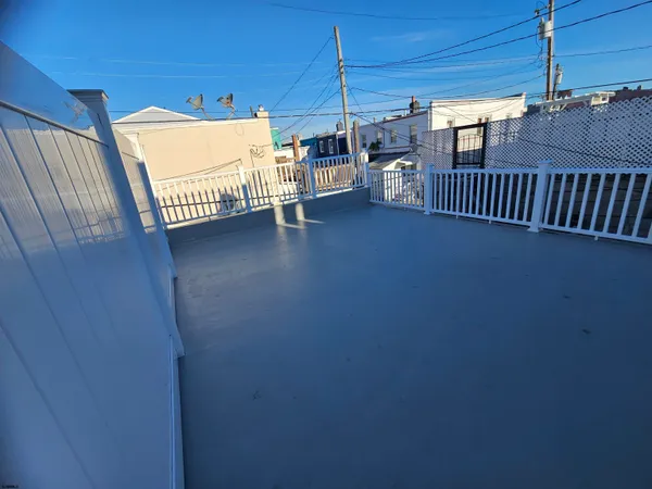 a view of a terrace with glass door and deck