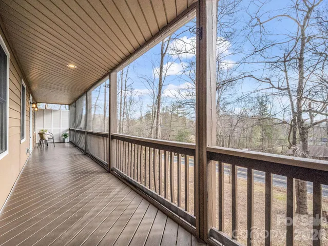 a view of a porch with wooden floor