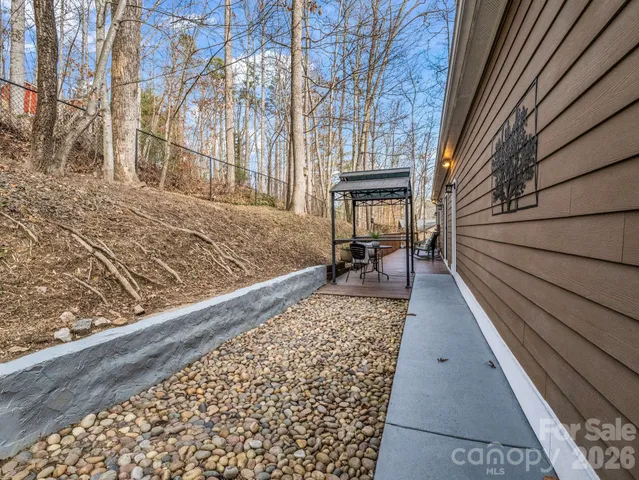 a view of balcony with wooden floor and seating space