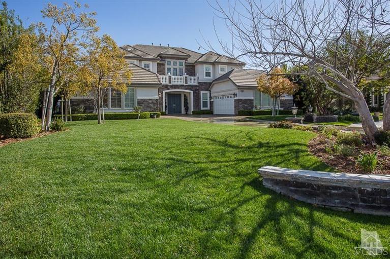 a front view of a house with a yard table and chairs