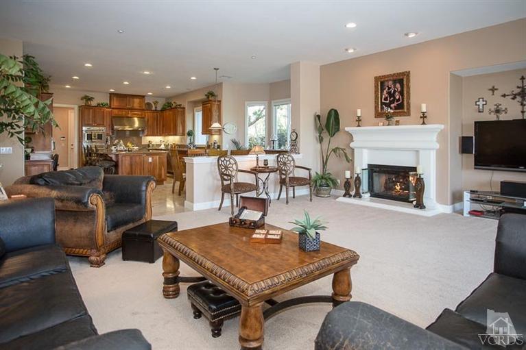 7216 Littler Court Moorpark, CA 93021 - Photo 13 of 92 a living room with furniture a fireplace and a flat screen tv