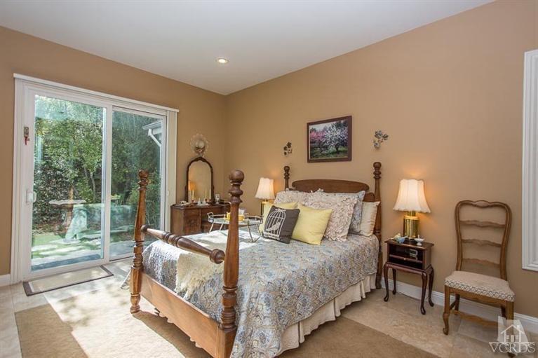 7216 Littler Court Moorpark, CA 93021 - Photo 26 of 92 a bedroom with a bed and a large window