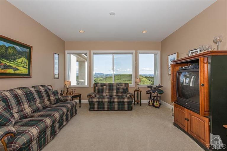 7216 Littler Court Moorpark, CA 93021 - Photo 29 of 92 a living room with furniture and a flat screen tv