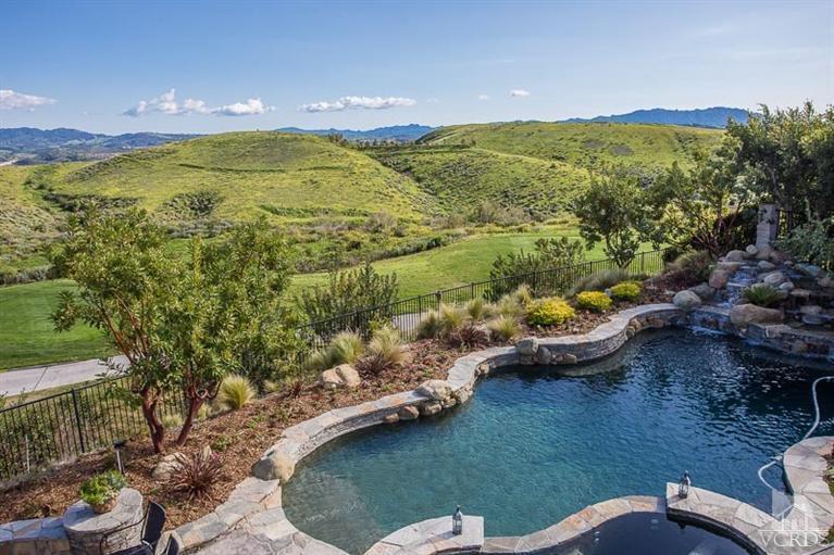 7216 Littler Court Moorpark, CA 93021 - Photo 34 of 92 a view of a lake with lawn chairs and large trees