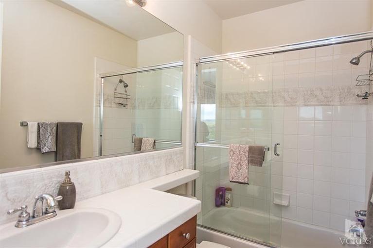 7216 Littler Court Moorpark, CA 93021 - Photo 49 of 92 a bathroom with a bathtub and a shower