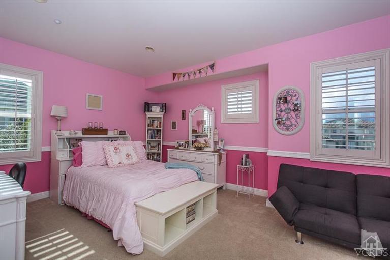 7216 Littler Court Moorpark, CA 93021 - Photo 51 of 92 a spacious bedroom with a bed and a couch