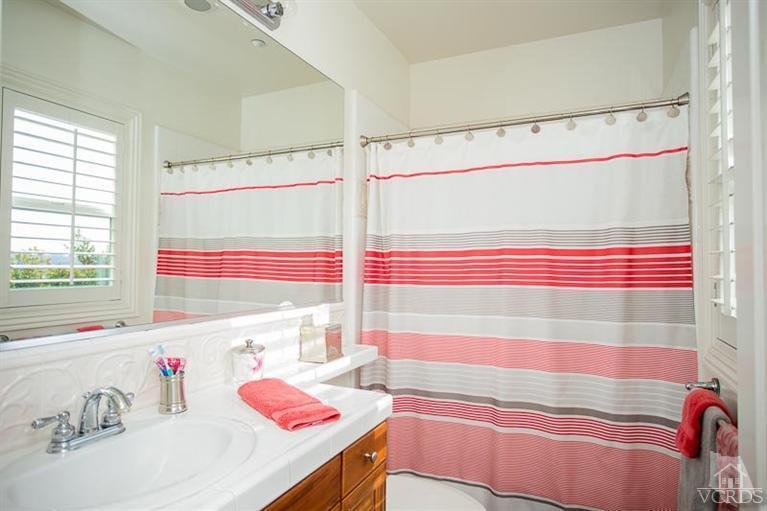 7216 Littler Court Moorpark, CA 93021 - Photo 53 of 92 a bathroom with a sink and a bathtub