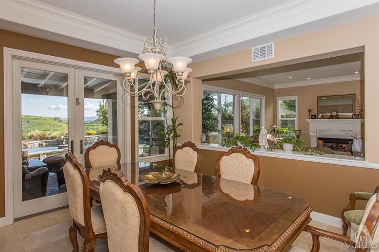 7216 Littler Court Moorpark, CA 93021 - Photo 8 of 92 a dining room with furniture a chandelier and window