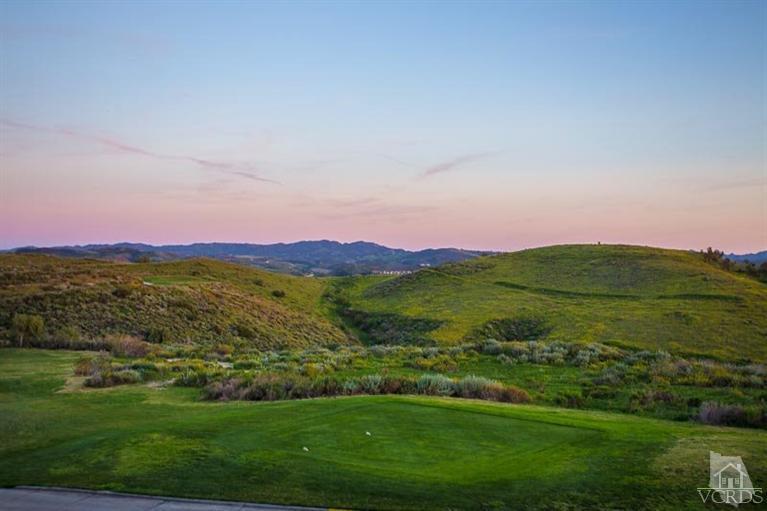 7216 Littler Court Moorpark, CA 93021 - Photo 77 of 92 a view of a lush green outdoor space with a swimming pool and valleys in the background