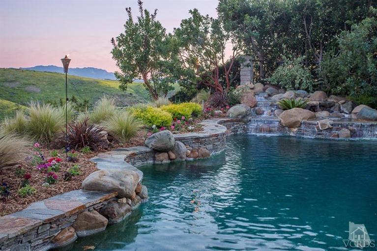 7216 Littler Court Moorpark, CA 93021 - Photo 82 of 92 a view of a lake with lawn chairs and a table