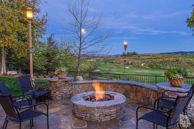 7216 Littler Court Moorpark, CA 93021 - Photo 88 of 92 a view of a patio with a table chairs and a fire pit