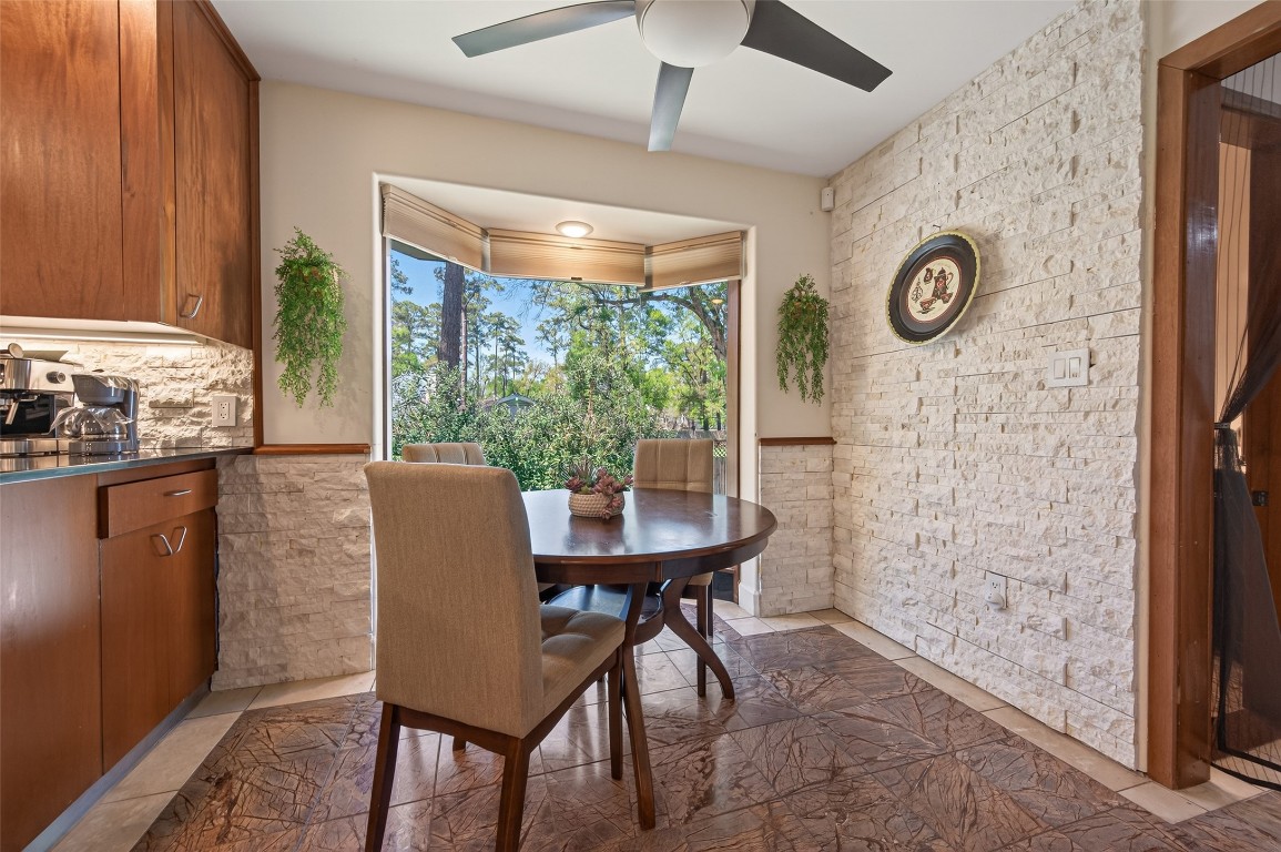 16914 Creeksouth Road Houston, TX 77068 - Photo 18 of 50 a view of a dining room with furniture and a window
