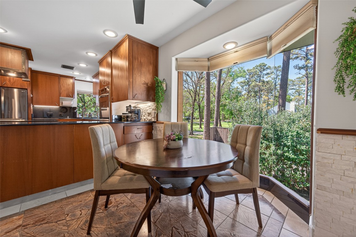 16914 Creeksouth Road Houston, TX 77068 - Photo 19 of 50 a view of a dining room with furniture window and outside view