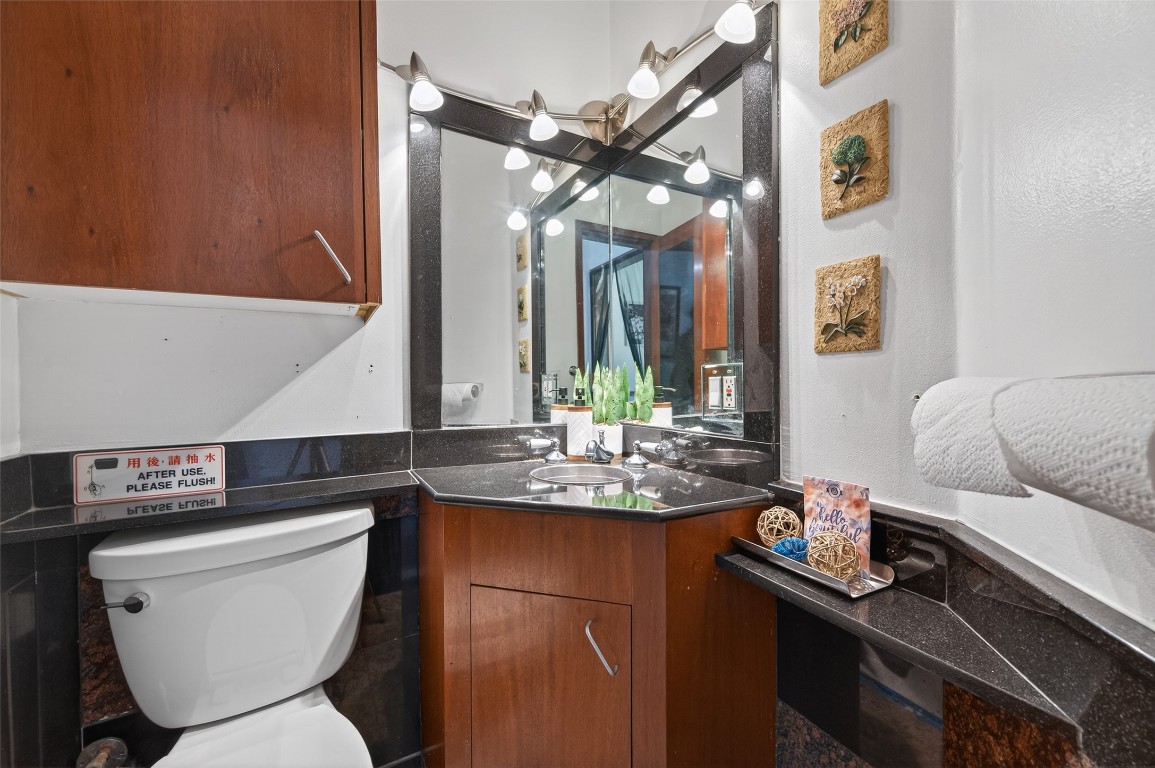 16914 Creeksouth Road Houston, TX 77068 - Photo 20 of 50 a bathroom with a toilet a sink and a mirror