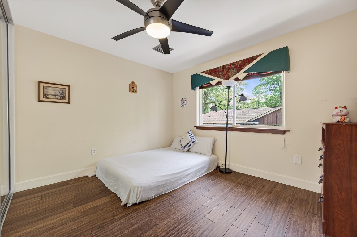 16914 Creeksouth Road Houston, TX 77068 - Photo 38 of 50 a bedroom with a bed and a large window