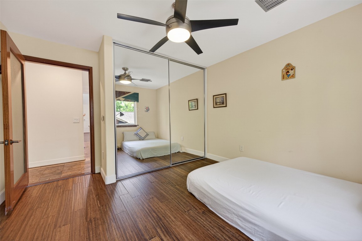 16914 Creeksouth Road Houston, TX 77068 - Photo 39 of 50 a bedroom with a bed and a couch