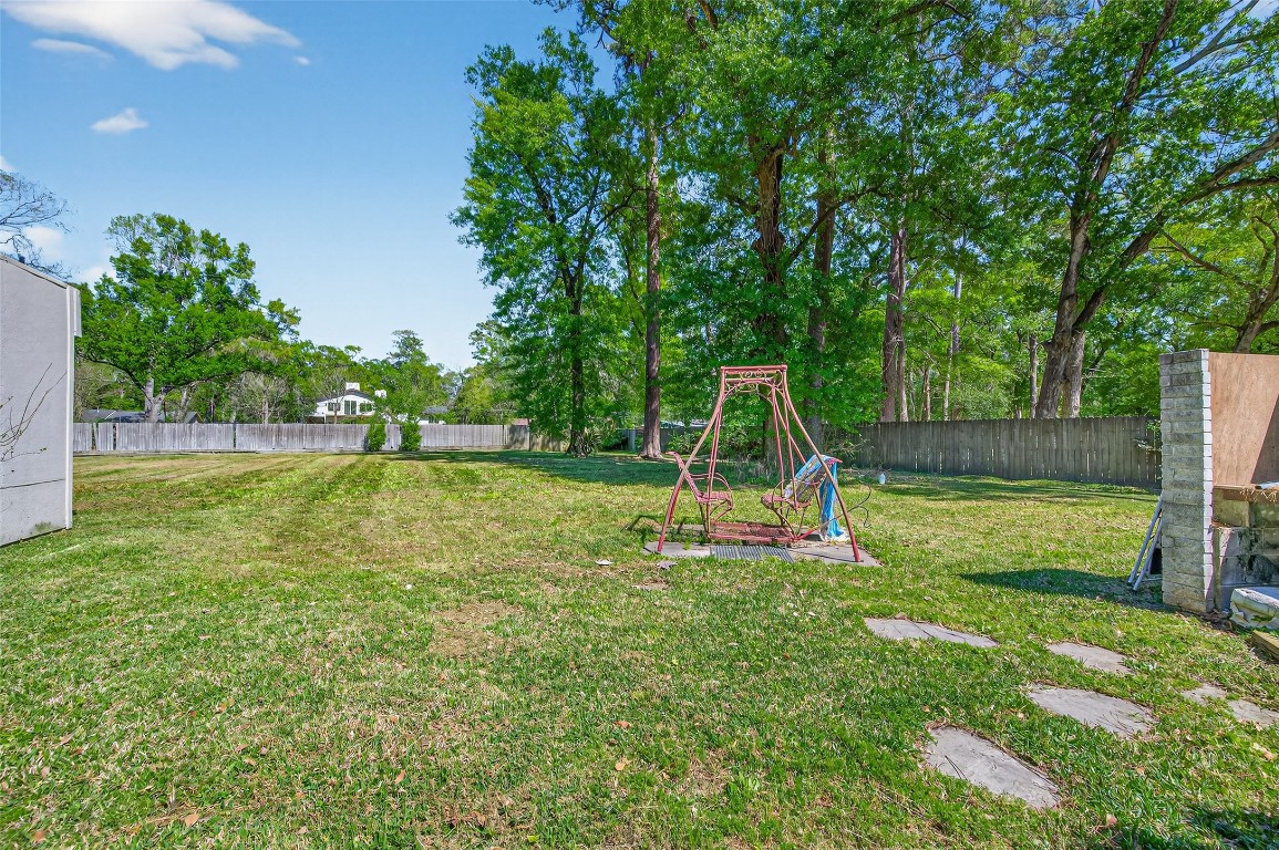 16914 Creeksouth Road Houston, TX 77068 - Photo 48 of 50 a view of a garden with a slide