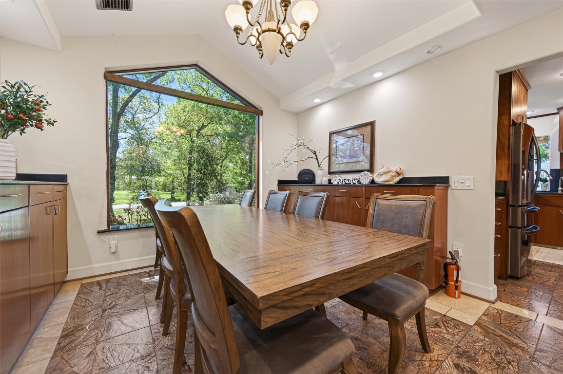 16914 Creeksouth Road Houston, TX 77068 - Photo 9 of 50 a view of a dining room with furniture window and outside view