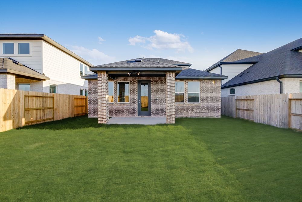 22119 Strathfield Circle Cypress, TX 77433 - Photo 24 of 37 a front view of a house with a garden