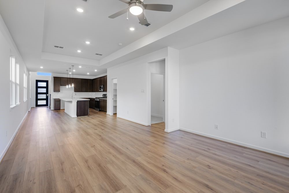 22119 Strathfield Circle Cypress, TX 77433 - Photo 8 of 37 a view of kitchen with furniture and wooden floor