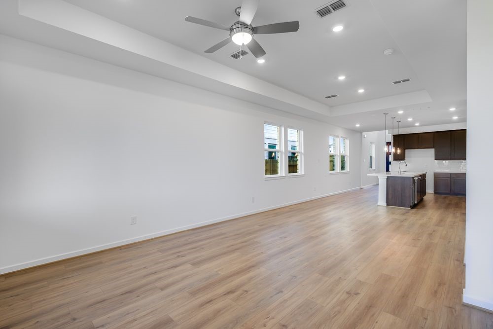 22119 Strathfield Circle Cypress, TX 77433 - Photo 9 of 37 a view of kitchen and hall with wooden floor