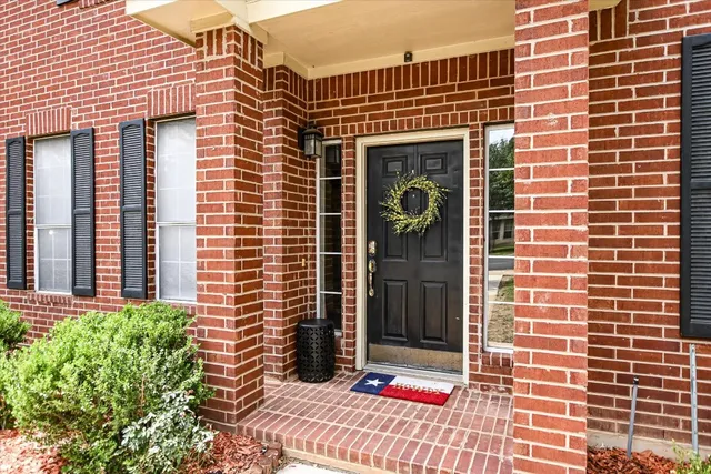 a front view of a building with glass windows
