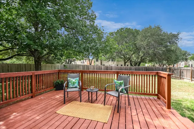 a view of balcony with deck and wooden floor