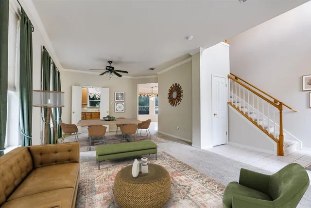 a living room with furniture and a rug