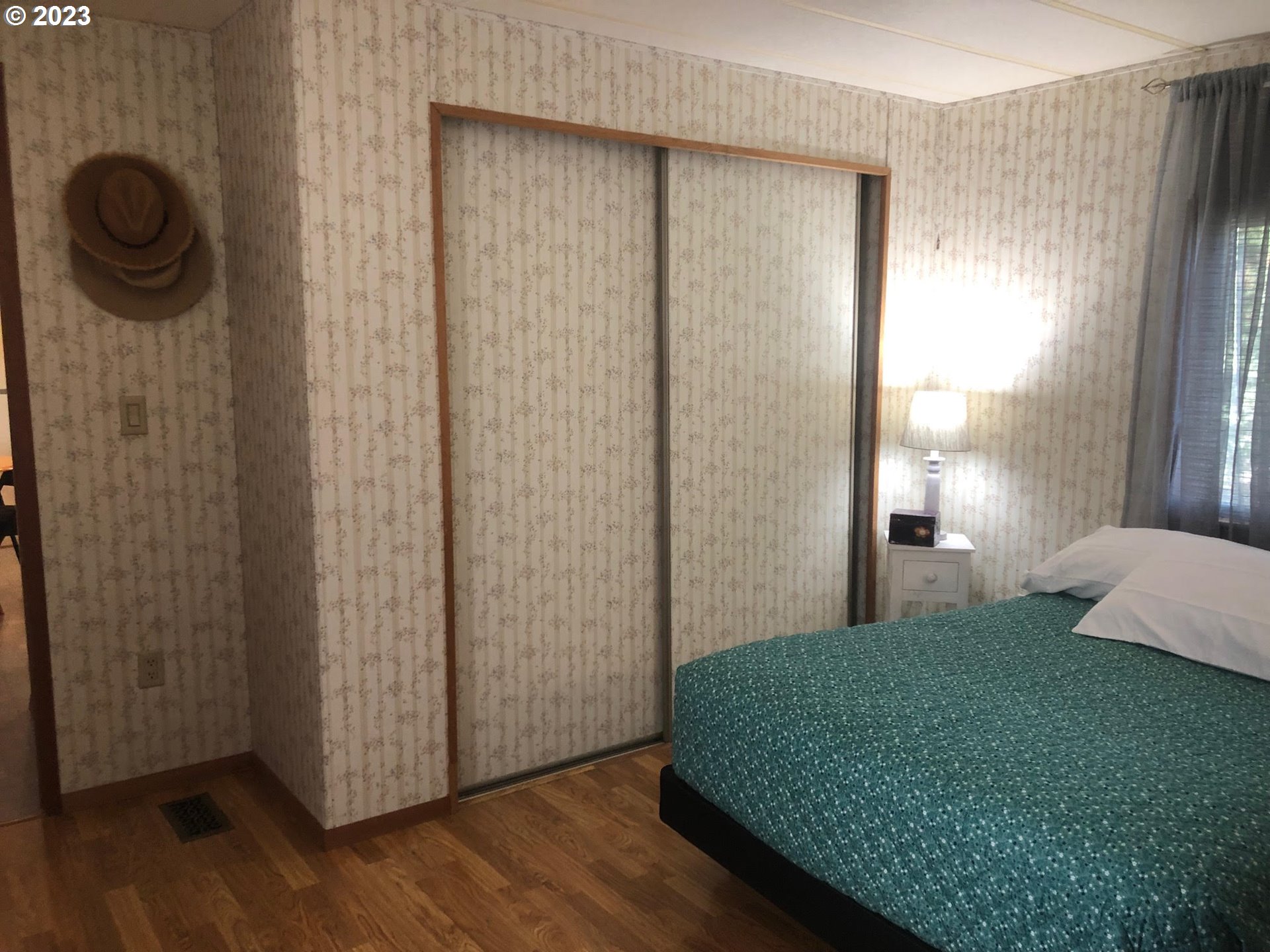 1809 26th Street, Unit 77 La Grande, OR 97850 - Photo 14 of 41 a bedroom with a bed and a window