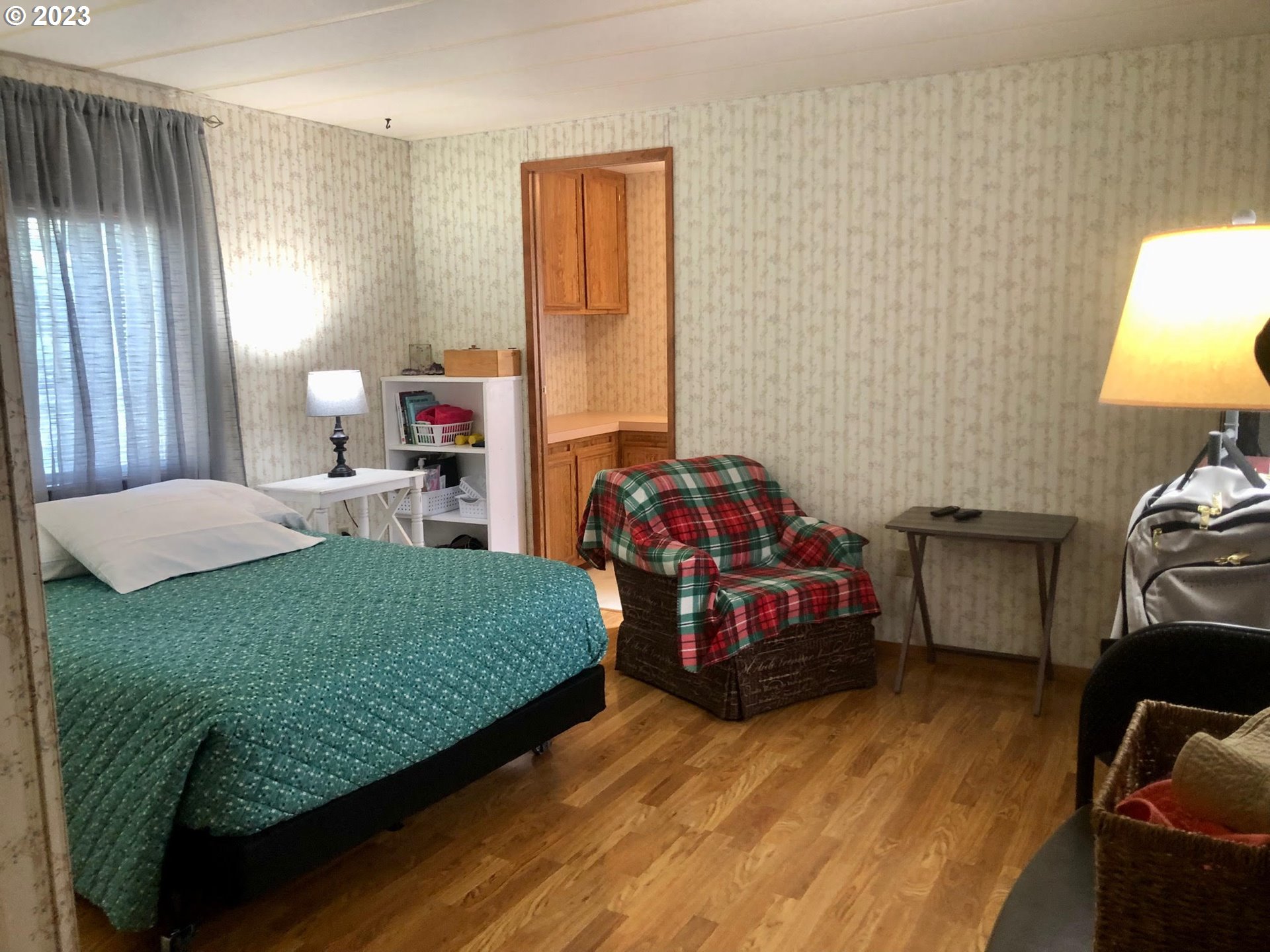 1809 26th Street, Unit 77 La Grande, OR 97850 - Photo 15 of 41 a bedroom with a bed and a window