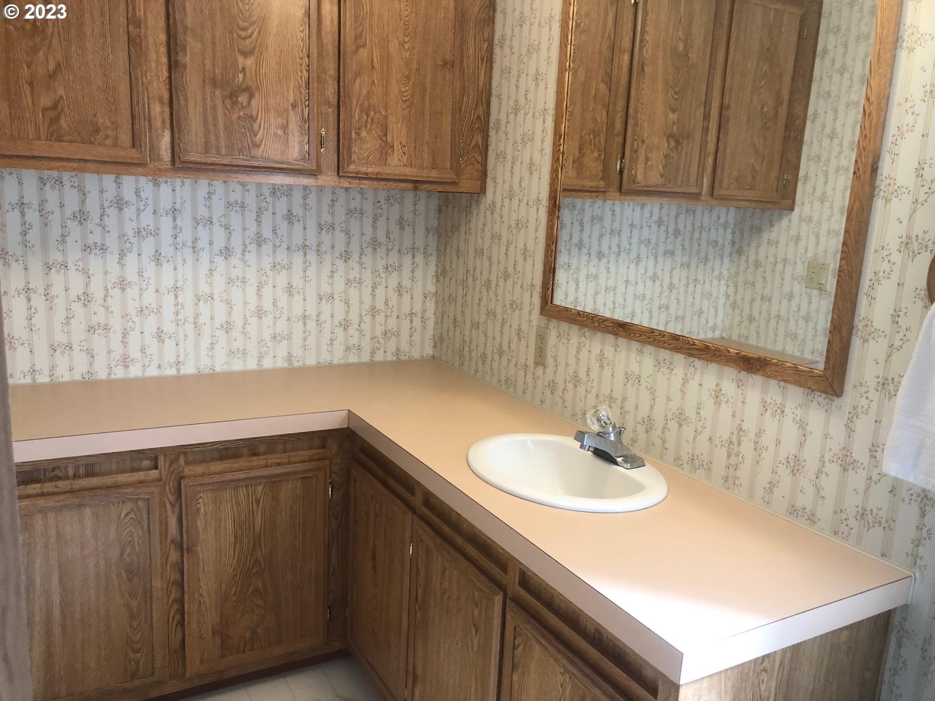 1809 26th Street, Unit 77 La Grande, OR 97850 - Photo 17 of 41 a bathroom with a sink and a mirror